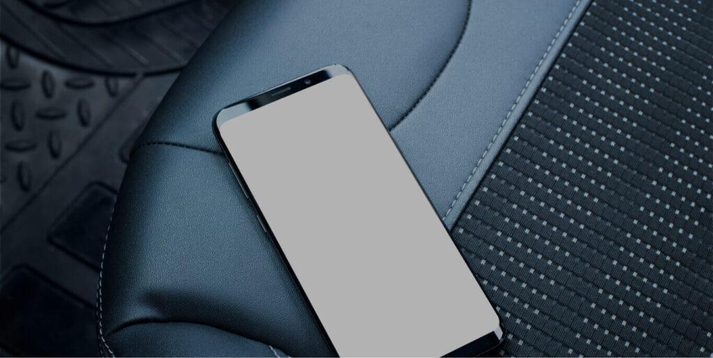 Android phone resting on car seat