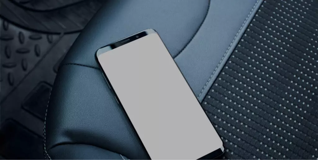 Android phone resting on car seat