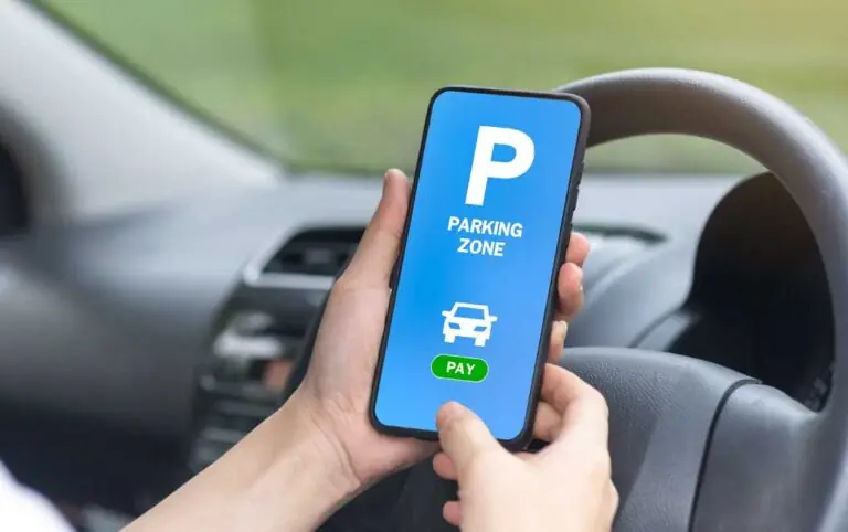 Customer finds parking on a mobile phone unaware that digital marketing for parking lots led them to this exact spot.